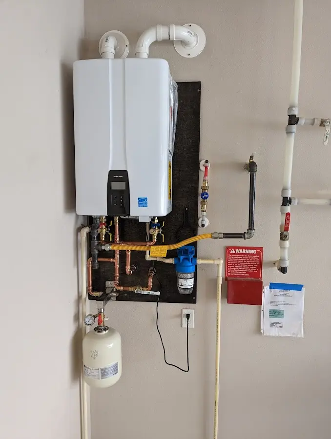 Professional plumber installing copper piping in a Prestonsburg home